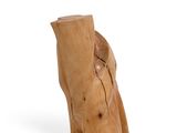 a wooden elephant that is sitting on a white surface