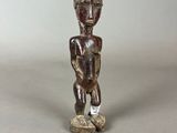 an image of a small statue of a man with a hat on his head