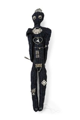 an image of a black voodoo doll with a knife in its hand