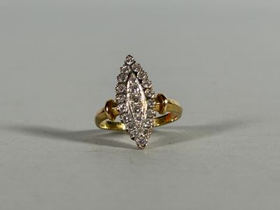 a close up of a diamond ring on a white surface