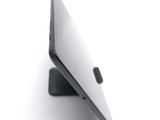 a close up of a laptop computer on a white surface