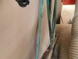 a hose attached to a wall next to a water tank