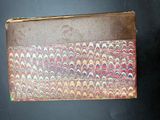an old book with a colorful design on it