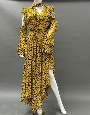 a yellow leopard print dress on a mannequin mannequin mannequin mannequin mannequin mannequin mannequin mannequin mann