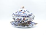 a blue and white bowl and saucer on a saucer