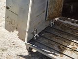 a dirty refrigerator that is sitting in the dirt