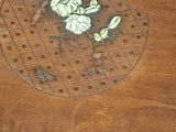 a wooden table with a drawing of a rabbit on it