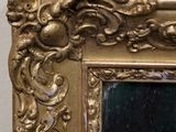 a picture of a gold frame with a cat in it