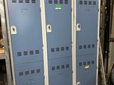two blue lockers sitting next to each other in a room