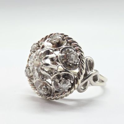an image of a ring with a cluster of diamonds on it