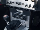 a car dashboard with a steering control and some buttons