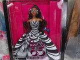 a barbie doll that is in a box on the table