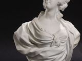 pair of white marble busts of a woman and a man