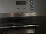 a close up of a stainless steel oven with electronic controls