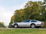 a silver car that is parked on the side of the road