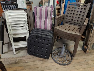 many chairs and a suitcase sitting on the floor