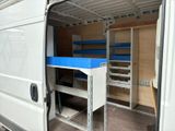 a white van with a blue tray in the back