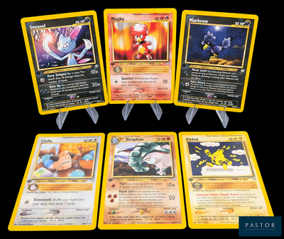 Quatre cartes Pokémon sont représentées sur un fond noir