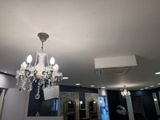 a chandelier hanging from the ceiling in a room