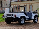 a white jeep that is parked in front of a building