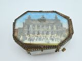 a small box with a picture of a building on it