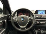 the interior of a bmw car with a steering wheel and dashboard