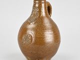 an image of a brown vase sitting on top of a white surface