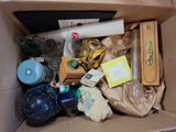 a cardboard box filled with assorted items in it