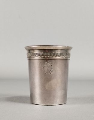 an antique silver cup with a design on the rim