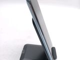 a cell phone that is sitting on a stand