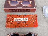 a pair of sunglasses and a pair of sunglasses on a table