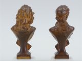 pair of bronze busts of a man and a woman on marble bases