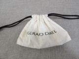 a white bag with black writing on it sitting on a table