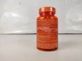 a bottle of vitamin supplement sitting on a table