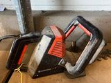 two chainsaws that are laying on the floor