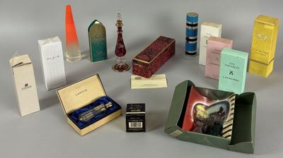 a lot of different types of perfumes in a box