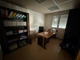 a room with a desk and a chair in it