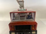 a toy fire truck with a ladder on top of it