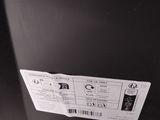 an image of a black refrigerator with a sticker on it