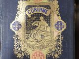 an old blue book with gold trim and a picture of a woman on it