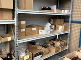 boxes are stacked on a shelf in a room with a lot of shelves