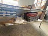 a shelf with boxes and boxes on it in a room