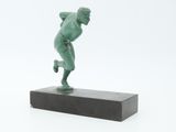 statue of a male athlete on a marble base