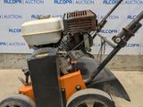a small lawn mower that is sitting on the ground