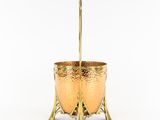 an image of a gold cup with a spoon in it