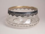 a close up of a glass bowl on a white surface