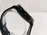 the back of a smart watch sitting on top of a white table