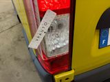a yellow van with a sticker on the back of it