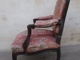 a chair with a red and pink upholstered upholstered seat