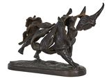 bronze statue of a bull with a rider on it ' s back